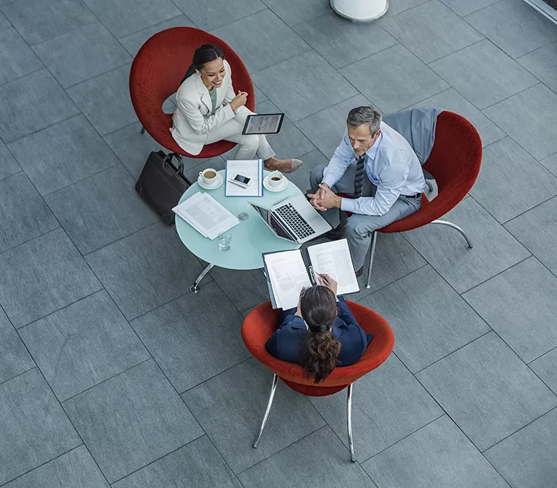 businesspeople discussing strategy at coffee table