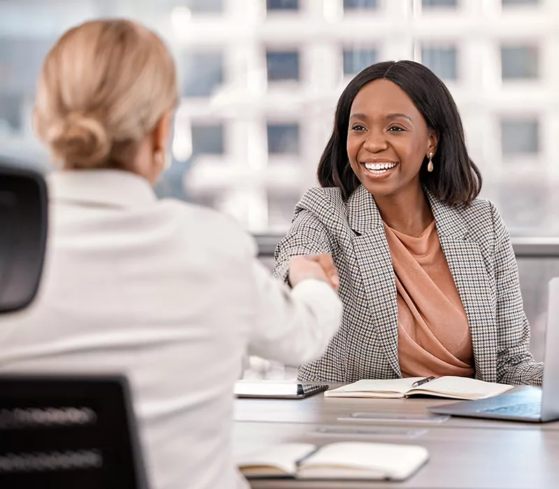 shot of a young businesswoman shaking hands with a fellow staff member